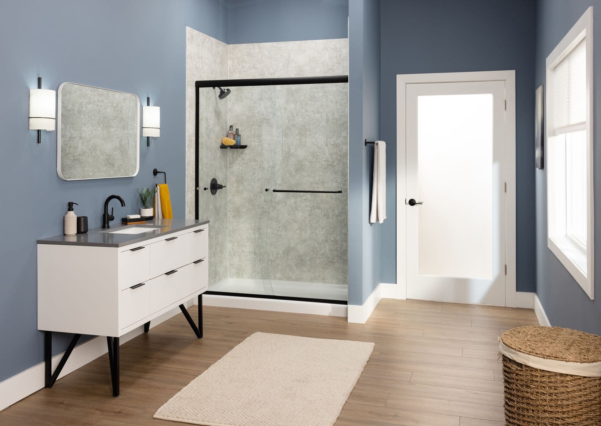 Modern bathroom with new bathtub and glass-enclosed shower in Milwaukee, WI
